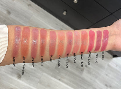 zavendria image of an arm showing different blush stick swatches 